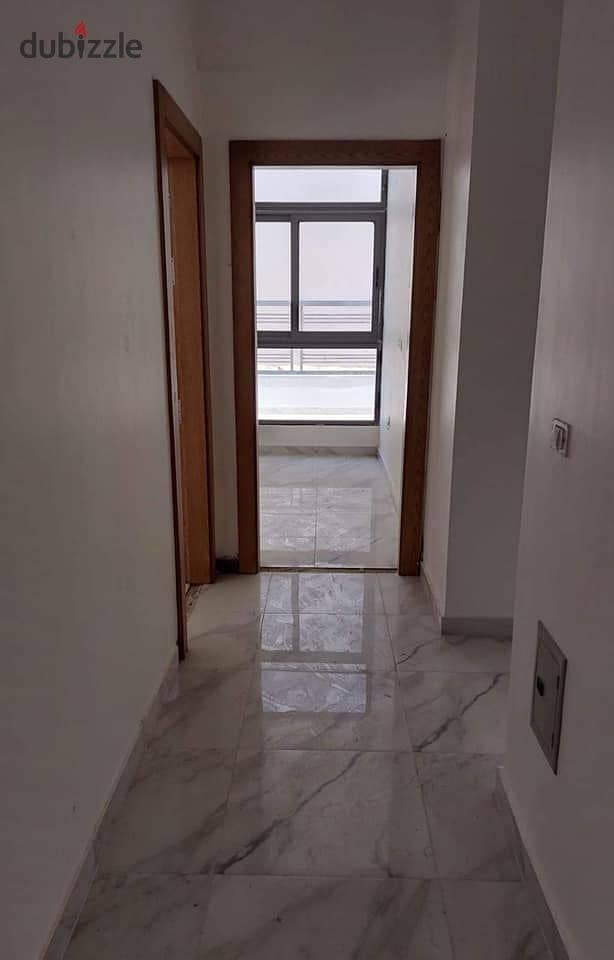 Apartment for sale in front of Dar Misr, Fifth Settlement, landscape view and swimming pools 4