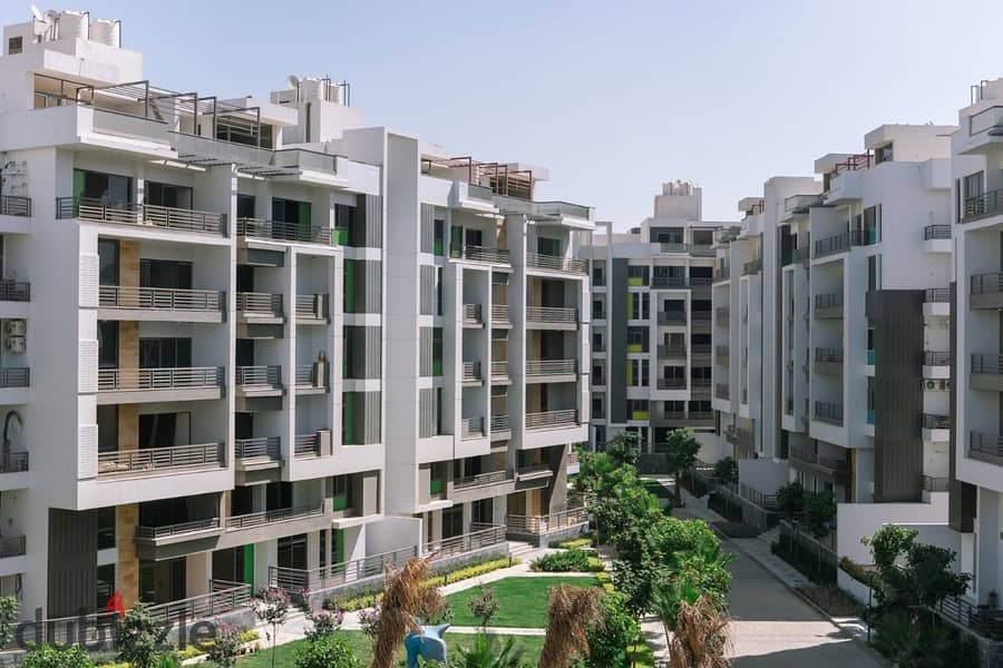 Apartment for sale in front of Dar Misr, Fifth Settlement, landscape view and swimming pools 10