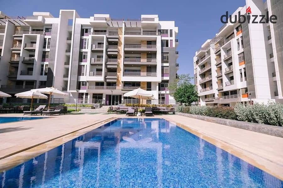 Apartment for sale in front of Dar Misr, Fifth Settlement, landscape view and swimming pools 13