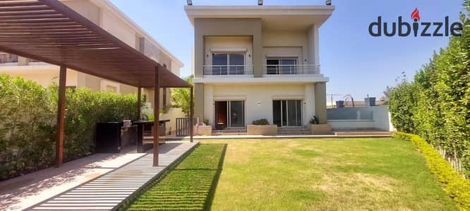 Super deluxe villa for rent, semi-furnished, with a garden, in Cairo Festival City