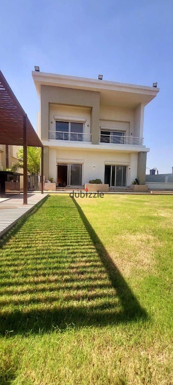 Super deluxe villa for rent, semi-furnished, with a garden, in Cairo Festival City 4