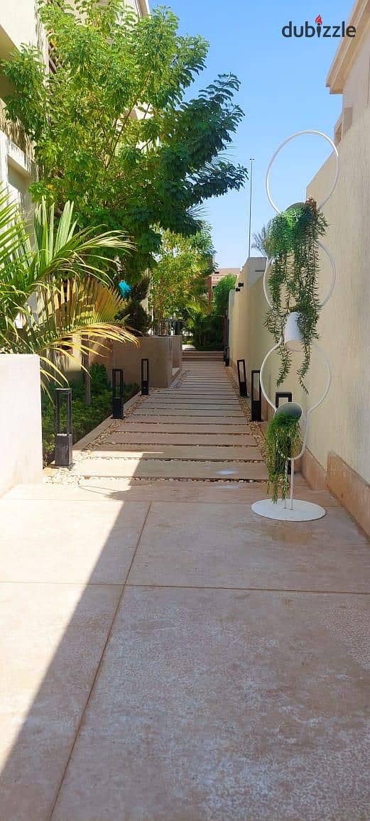 Super deluxe villa for rent, semi-furnished, with a garden, in Cairo Festival City 24