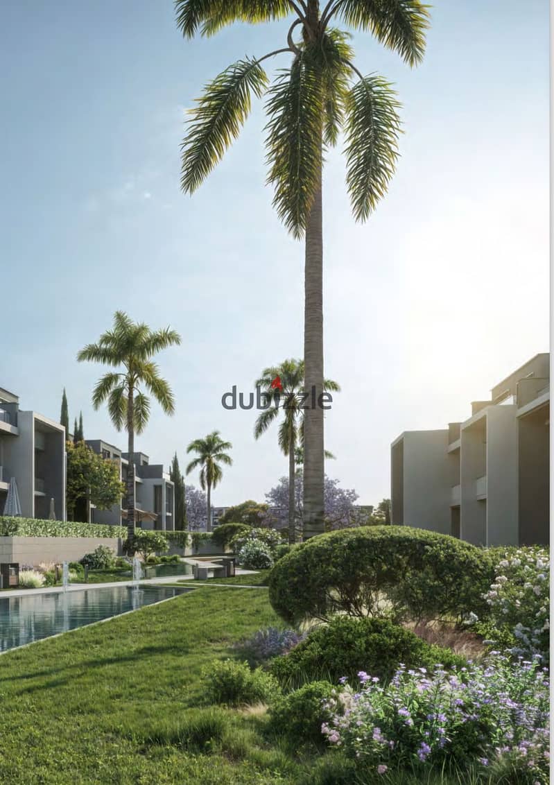 Own an apartment with a landscape view in front of Al Jazeera Club, with installments over 8 years, PALM HILLS THE CROWN 1