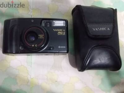 كاميرا فيلم نوعها yashica MG-2 auto flash أستعمال خفيف وبالجراب الاصلي