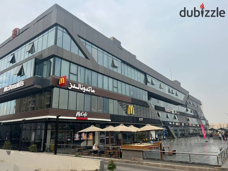 Own a commercial store in the heart of Sheikh Zayed, directly on the Dahshour link, with the most powerful real estate developer, owner of The Gate 19