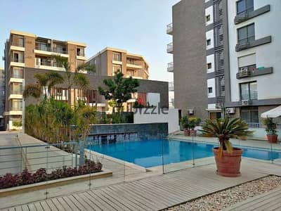 Luxury apartment for sale in installments on a very special view on the landscape in front of Cairo Airport in the Taj City compound