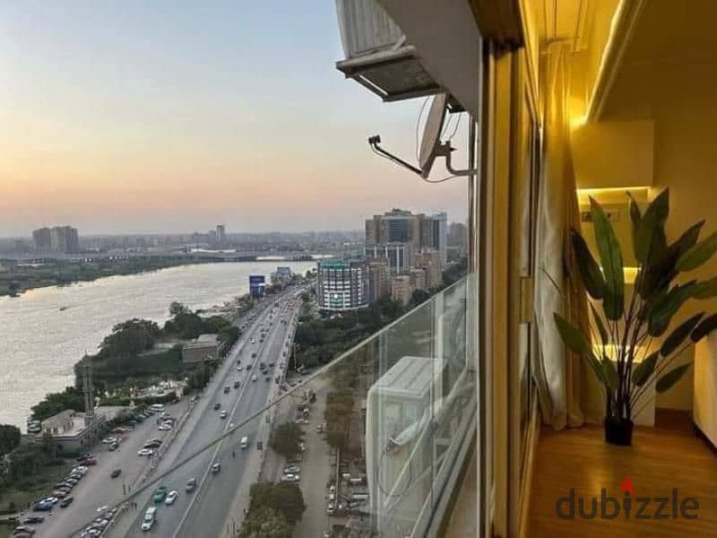 Apartment next to Hilton with a wonderful view, first row directly on the Nile, fully finished with furniture, appliances and air conditioners, and in 10