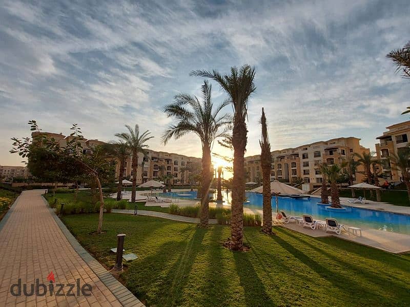 The cheapest price for a two-bedroom apartment, Ready To Move, direct view of the swimming pool, in Stone Residence, Fifth Settlement, New Cairo. 3