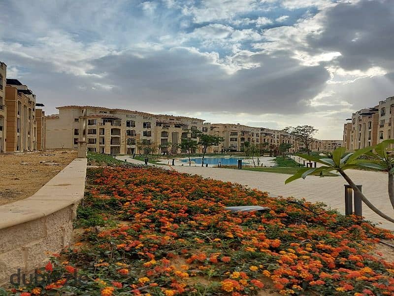 The cheapest price for a two-bedroom apartment, Ready To Move, direct view of the swimming pool, in Stone Residence, Fifth Settlement, New Cairo. 8