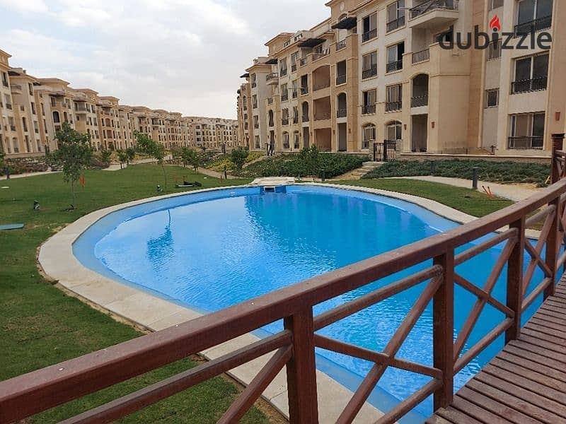 The cheapest price for a two-bedroom apartment, Ready To Move, direct view of the swimming pool, in Stone Residence, Fifth Settlement, New Cairo. 11