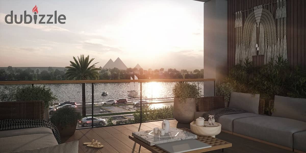 A luxurious hotel suite, fully furnished and air-conditioned, boasting direct Nile views. 1