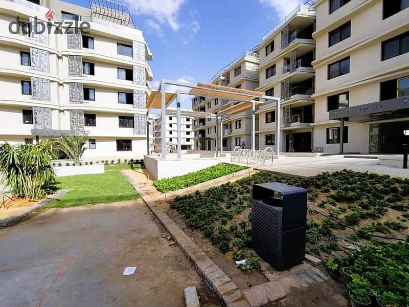 Fully finished apartment with garden for sale at a very special price in Badya Palm Hills Compound in 6th of October 10