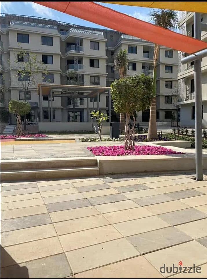 Fully finished apartment with garden for sale at a very special price in Badya Palm Hills Compound in 6th of October 11