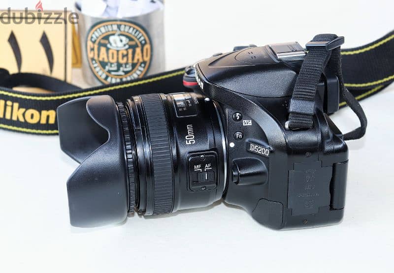 نيكون D5200 بلينس يونجنو 50mm F1.8G حالة الزيرو وكوفر سليكون 3