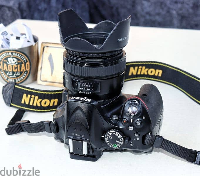 نيكون D5200 بلينس يونجنو 50mm F1.8G حالة الزيرو وكوفر سليكون 7