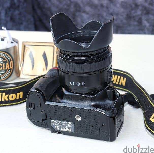 نيكون D5200 بلينس يونجنو 50mm F1.8G حالة الزيرو وكوفر سليكون 8