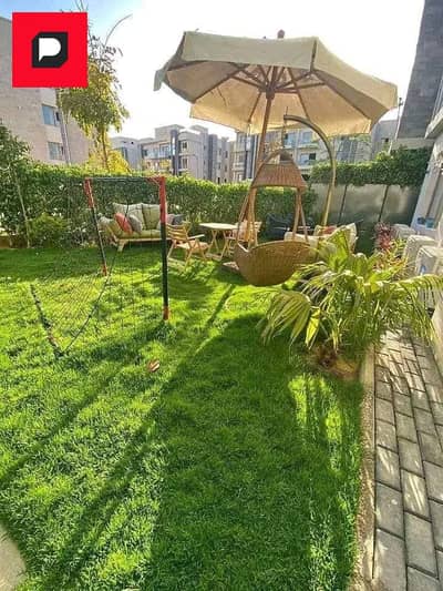 Apartment with garden, prime location for sale in Taj City Compound, in front of Cairo Airport, near the First Settlement and minutes from Madinaty