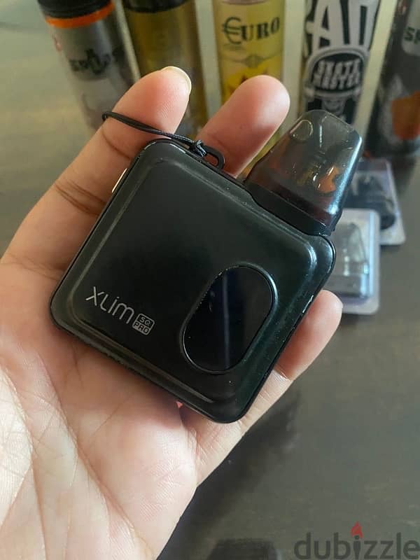 SQ Xlim Pro with accessories and liquid 6