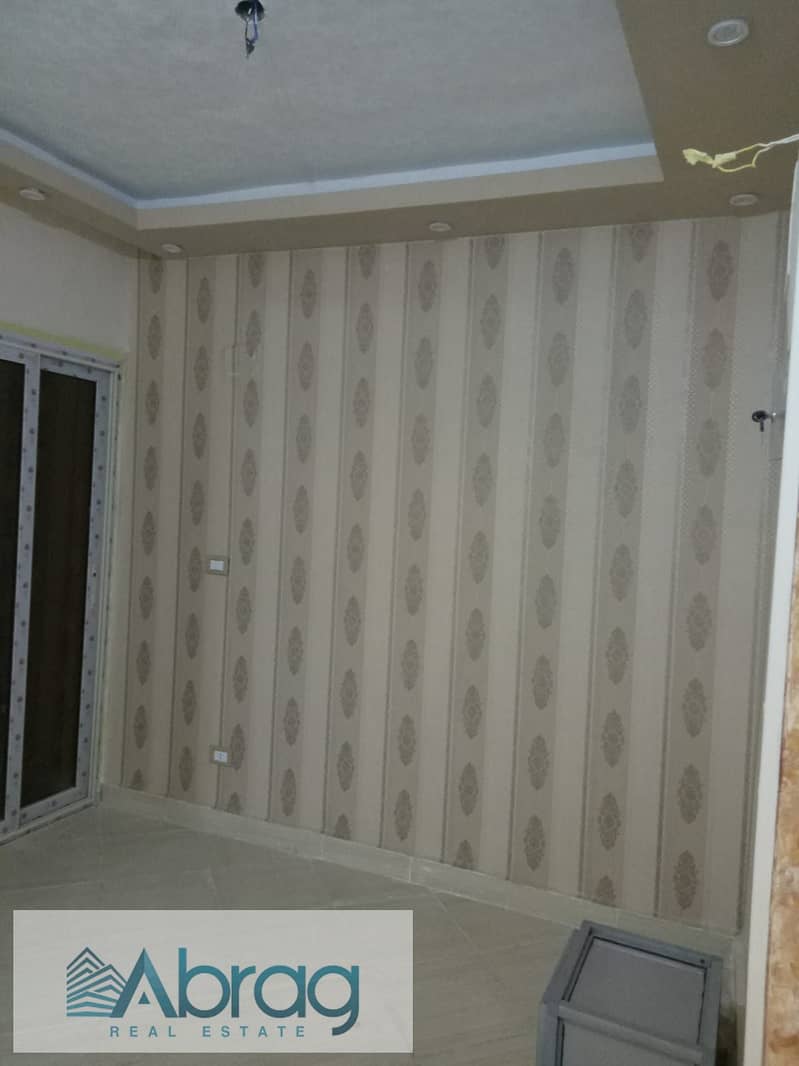 For sale in Al-Firdaus Compound, apartment 92, ultra super deluxe finishing, 6th of October 6