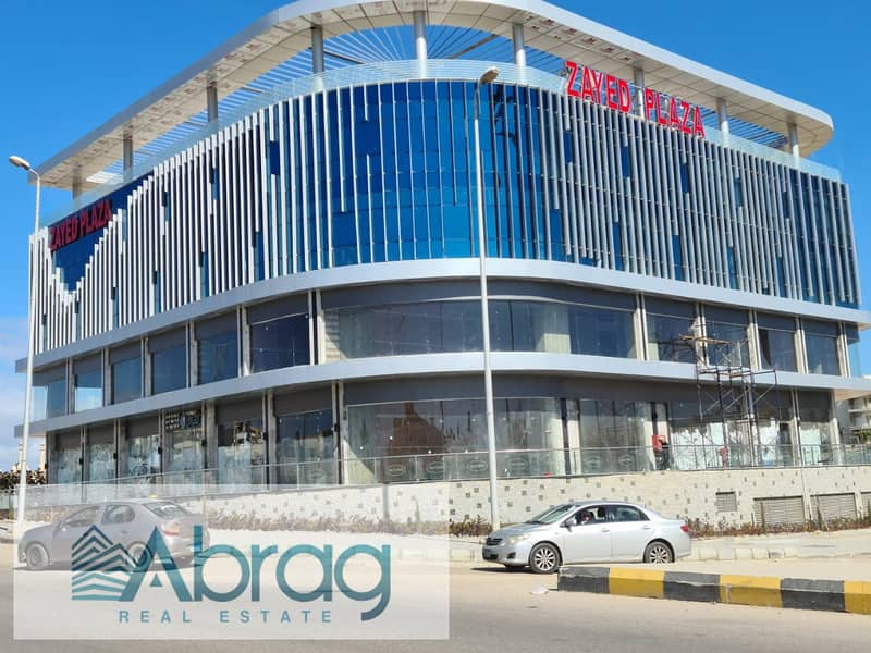 For sale, a commercial store, 88 square meters, ground floor, immediate receipt, installments, Zayed Plaza Mall, Sheikh Zayed 2