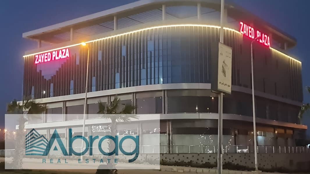 For sale, a commercial store, 88 square meters, ground floor, immediate receipt, installments, Zayed Plaza Mall, Sheikh Zayed 4