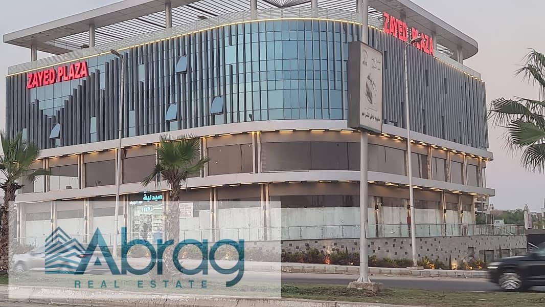 For sale, a commercial store, 88 square meters, ground floor, immediate receipt, installments, Zayed Plaza Mall, Sheikh Zayed 5