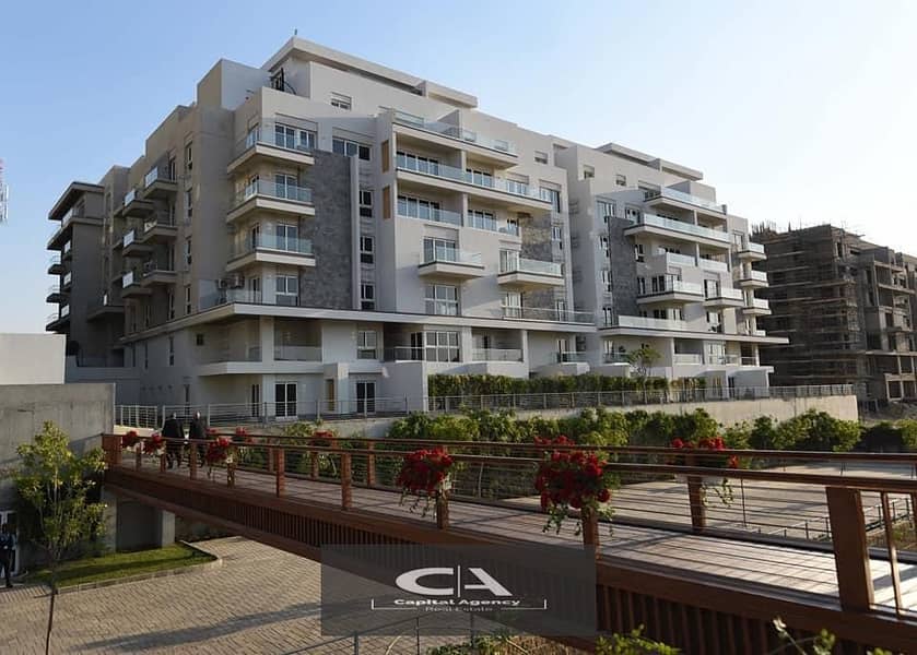 own an apartment with immediate receipt in Mountain View iCity Compound, New Cairo View on the lagoon with only 10% down payment * Mountain View I Cit 26