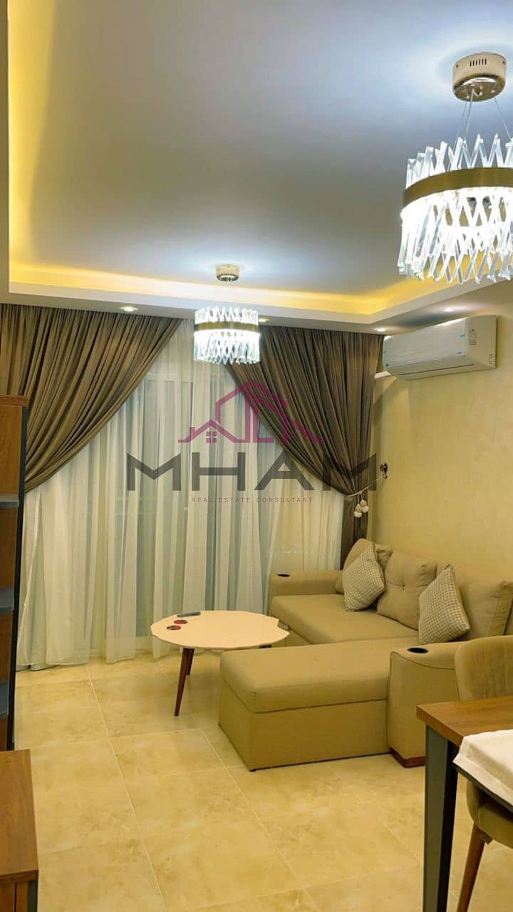 Furnished apartment for rent in Madinaty B12, 86 sqm, ground floor, 60 sqm garden, near the Craft Zone, the mosque, the medical center, and the East H 0