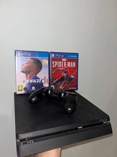 PS4 Slim with 2 Videogames 0