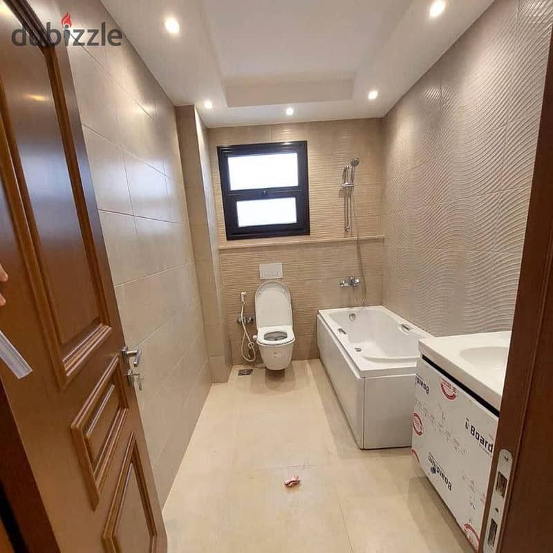 1 of the most important locations next to Almaza City Center, three rooms finished with kitchen and air conditioners, near Taj City Compound, 20 minut 33