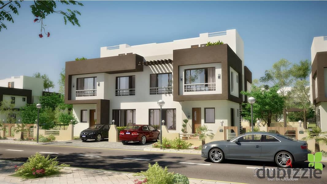 Townhouse for sale with a landscape view, located behind Mall of Arabia in Grand Heights. 0