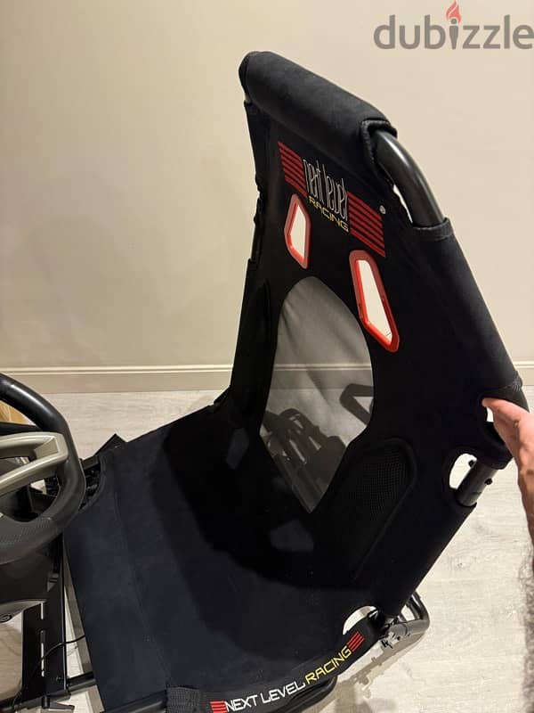 car seat, steering wheel and pedals 2