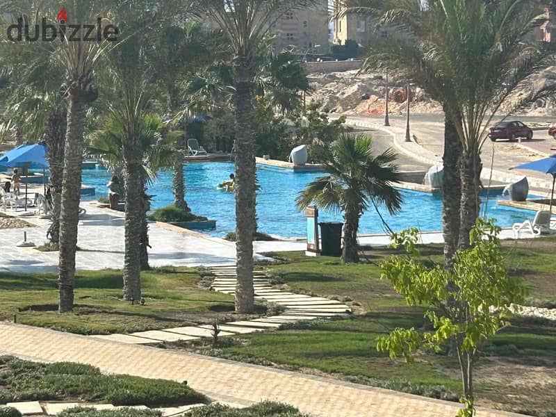 Chalet in Amwaj at the lowest prices + 3 bedrooms + 2 toilets + sea views + overlooking 3 swimming pools + premium finishing and fully air-conditioned + with an area of 144 0