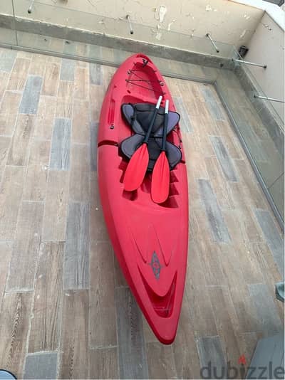 Red Kayak with paddle