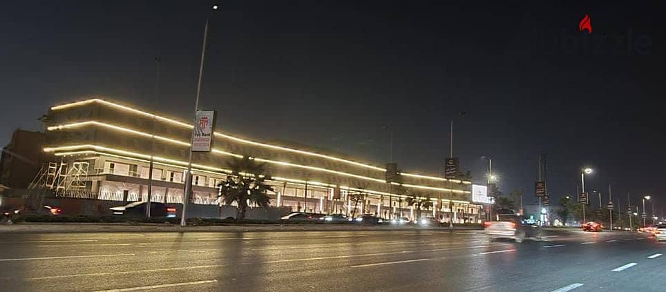 Next to Waterway, ready for delivery, a commercial store for sale in the Fifth Settlement, directly on the 90th Street, Mohamed Naguib Axis, from the 19