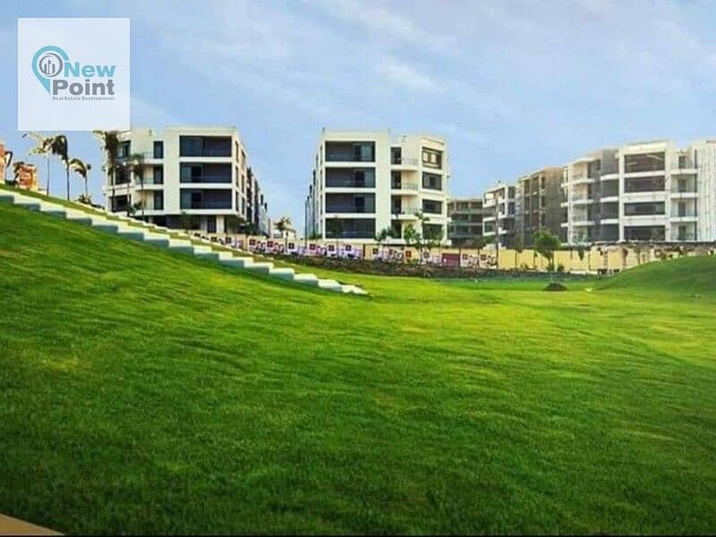 In front of Gardenia City, own an apartment with a garden of 130 square meters with Madinaty in Taj City, First Settlement 2