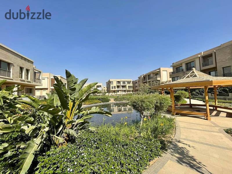 For sale, an apartment with a private garden, in a prime location in the heart of the compound, with a fantastic discount 1