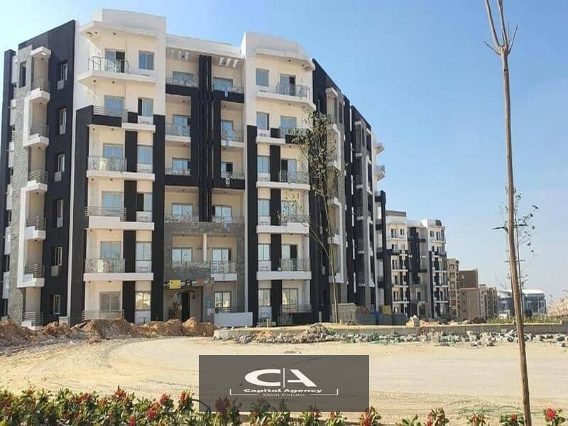 Two-room apartment for sale ready to move with only 5% down payment prime location in front of the iconic tower in al maqsad compound 18