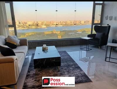 Apartment for sale Ready to move View the Nile, prime location on Maadi Corniche, minutes from Zamalek, in front of Gold Island, in Reve Dunil Tower