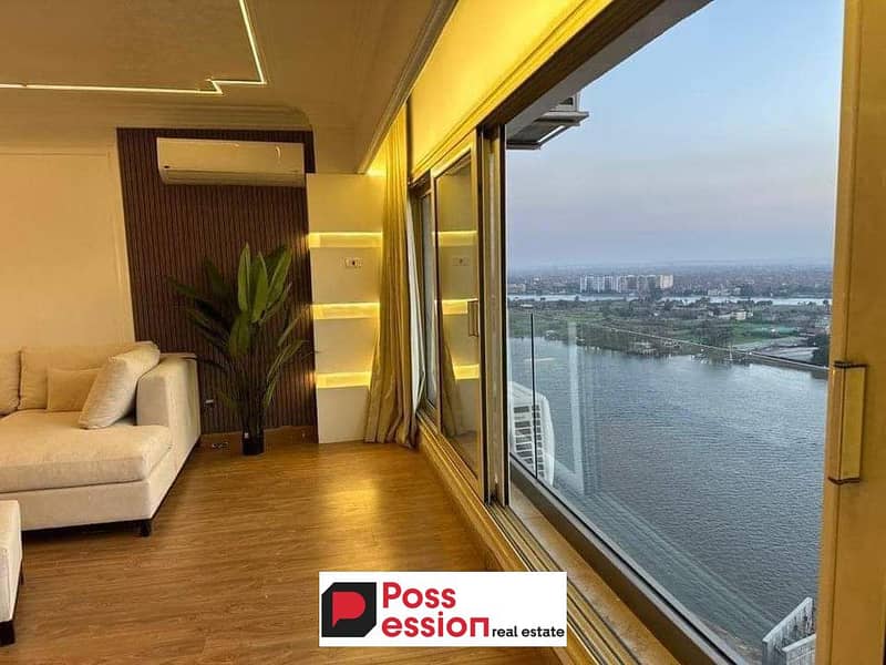 Hotel apartment for sale on the Nile directly next to Hilton Maadi, immediate delivery in installments, finished with furniture, appliances and air co 0