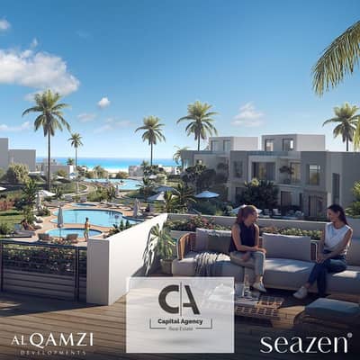 Own a chalet with a 10% down payment, fully finished, with kitchen and air conditioners - in Al Qamzi Company on the North Coast | Seazen