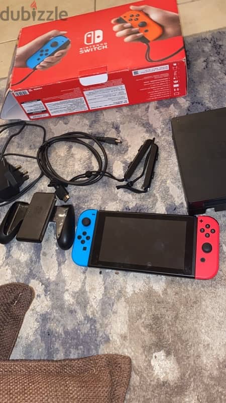 nintendo switch + all the controllers with the box 0