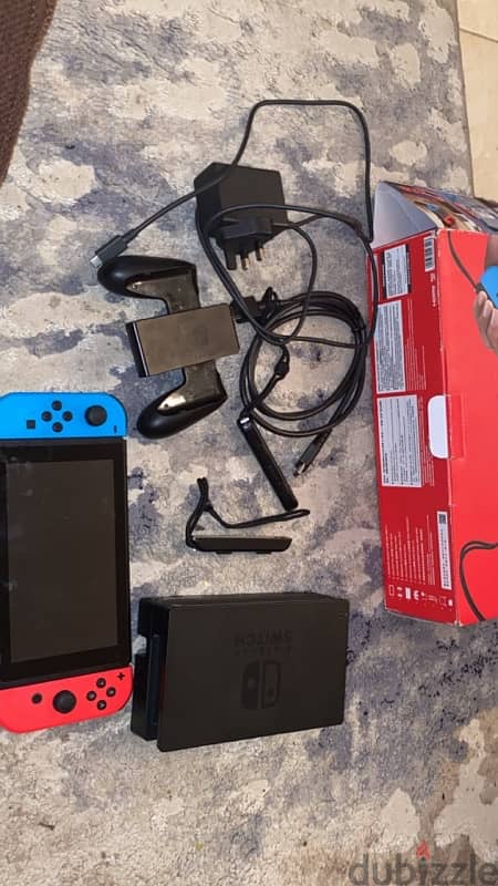 nintendo switch + all the controllers with the box 1