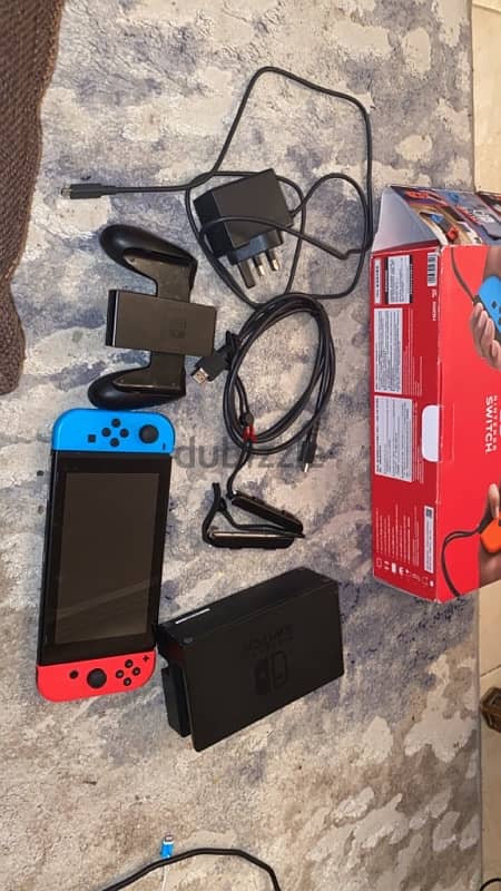 nintendo switch + all the controllers with the box 2