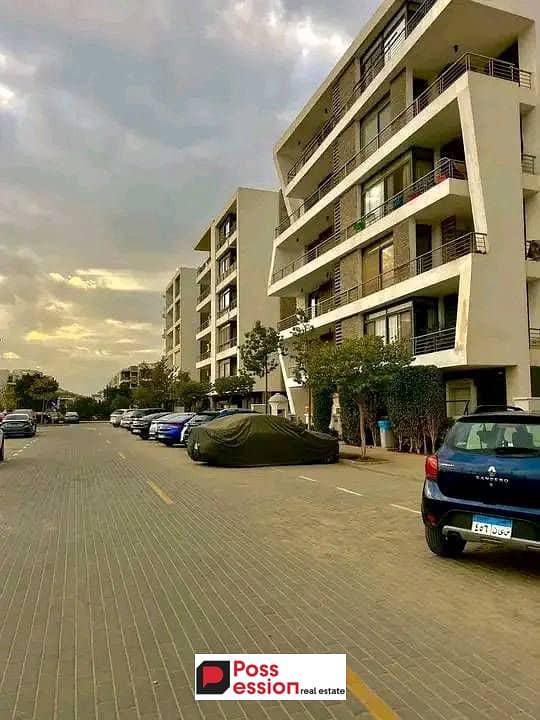 Two-bedroom apartment with a double view for sale in Taj City Compound in New Cairo on the Suez Road in front of Cairo Airport and near 5th Settlement 0