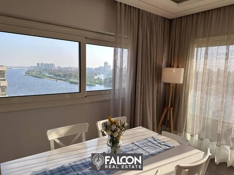 For sale, an apartment with ready to move , hotel finishing, with furniture and air conditioners, panoramic view of the Nile Corniche, next to the 0