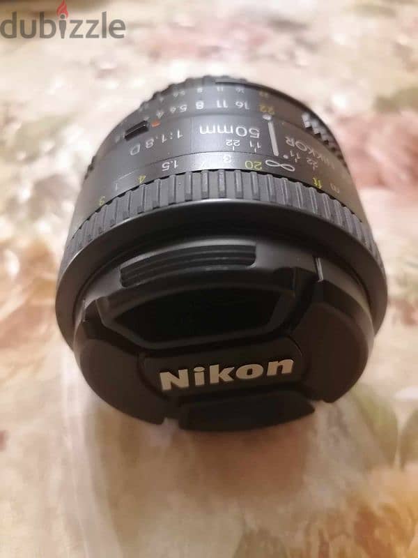 عدسة نيكون Nikon 50mm 1.8 للبيع بدون خربوش واحد بحاله الزيرو 0