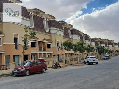 In front of the airport, own a middle townhouse with Madinet Masr, with installments over 12 years, in the heart of Mostakbal City