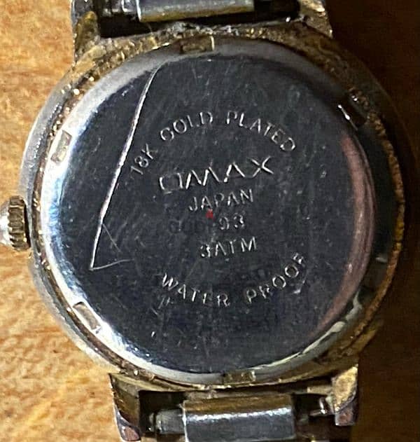 ساعة omax quartz مطلية ذهب عيار ١٨ 1