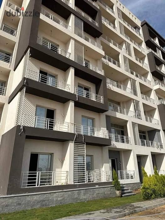 Apartment for sale at half price in the company, installments over 7 years, in The City Compound, the New Administrative Capital, in the heart of R7 0